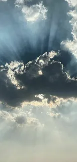 Dramatic clouds and sun rays in the sky, ideal for mobile wallpaper.