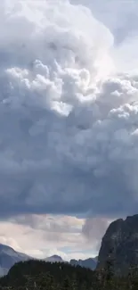 Dramatic clouds over a mountain landscape.