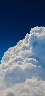 Vibrant blue sky with fluffy white clouds, ideal for a calm mobile wallpaper.