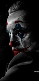 Dramatic clown face with red and blue paint on dark background wallpaper.