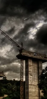 Towering construction crane under dark stormy clouds.