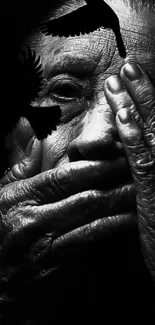 Black-and-white portrait of elderly person with textured hands and birds.