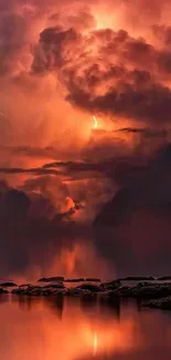 Fiery sunset with dramatic clouds over calm water.