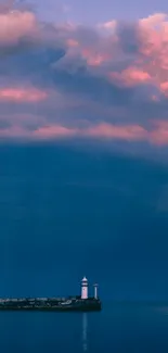 Lighthouse with colorful sunset sky and ocean view.