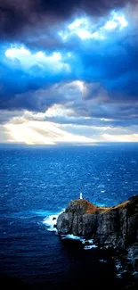 Lighthouse on a cliff with dramatic ocean and sky.