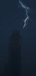 Dark cityscape with lightning striking a skyscraper at night.