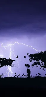 Silhouette trees with dramatic lightning in a dark sky mobile wallpaper.