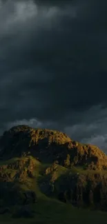 Dark mountain landscape under moody skies.