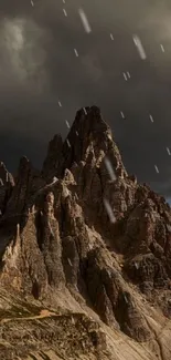 Mountain peaks under stormy dark clouds.