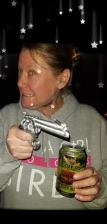 Person with toy gun and beer in starry night background.