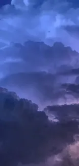 Dramatic purple and blue storm clouds in a night sky wallpaper.