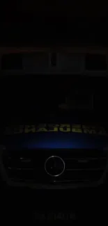Heroic ambulance illuminated in darkness.
