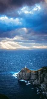 Dramatic ocean view with sunlit cliff and cloudy sky.
