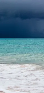 Stormy ocean horizon with dark clouds and teal water.