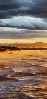 Stunning view of an ocean sunrise with fiery orange and cool blue clouds.