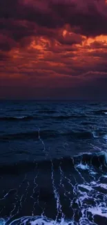Dramatic ocean under a vibrant purple and orange sunset sky.