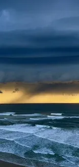 A dramatic ocean sunset with dark stormy clouds and vibrant gold horizon.