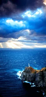 Dramatic ocean view with cliffs and lighthouse under a vibrant sky.