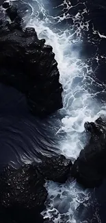 Dark rocks and foamy waves ocean view wallpaper.