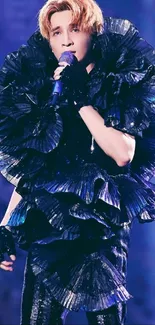 Performer in ruffled costume singing on stage wallpaper.