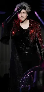 Charismatic performer in dark stage attire with dramatic lighting.