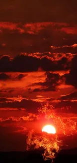 Fiery red sunset with dramatic clouds and horizon view.