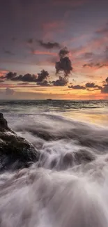 Dramatic seascape at sunset with colorful sky and crashing waves.