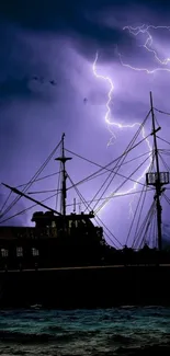 Silhouette of a ship under lightning-filled night sky.