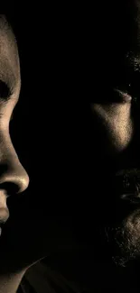 Dramatic silhouette of two faces in artistic contrast.