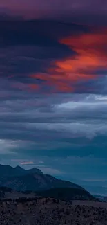 Dramatic evening sky over mountains with vibrant purple hues.