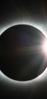 Mobile wallpaper showing a solar eclipse with radiant sun flares.