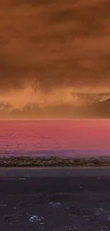 Vibrant orange and pink sunset beach view.