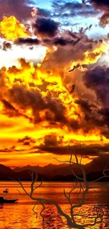 Orange sunset over calm lake with vibrant clouds.