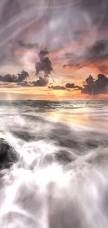 Dramatic sunset over ocean waves and rocky shore.