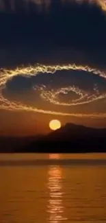 Spiral clouds in sunset sky reflecting over calm water.