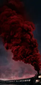 Steam train emitting red smoke in dark scenery.