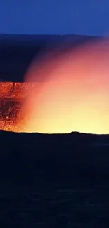 Vibrant volcanic eruption with fiery tones against a dark landscape.