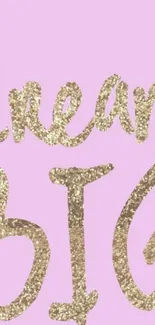 Glittery gold 'Dream Big' text on pastel pink wallpaper.