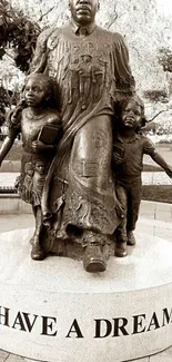 Sepia-toned memorial statue with 'I Have a Dream' inscription.