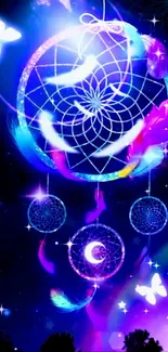 Glowing dreamcatcher with vibrant feathers in a starry night sky background.