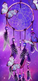 Purple dreamcatcher with butterflies and feathers on a galaxy background.