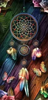 Dreamcatcher with colorful feathers and butterflies on a wooden background.