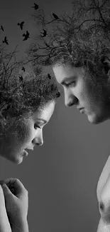 Black and white artistic silhouette of lovers blending with nature.