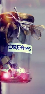 Glass jar filled with colorful paper stars labeled 'dreams' hanging on a wall.