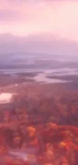 Blurred autumn landscape with pink sky and fall foliage, ideal for wallpaper.