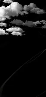 Dreamy black and white clouds on a dark background.