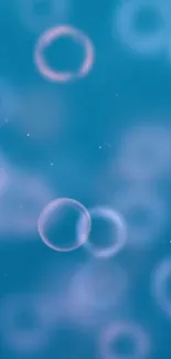 Dreamy blue bubble wallpaper with soft circles.