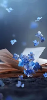 Open book with blue flowers floating in air.