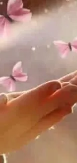 Pink butterflies fluttering over open hands in soft light.