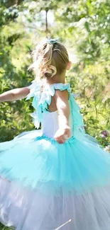 Child in blue tulle dress twirling in sunlit garden.